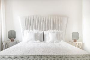 Ліжко або ліжка в номері Apartamento con solera en el corazón de Triana
