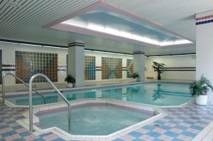 The swimming pool at or close to Cartier Place Suite Hotel