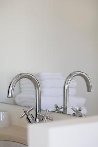 a kitchen sink with two chrome faucets at Villa Vagabonde in Gordes