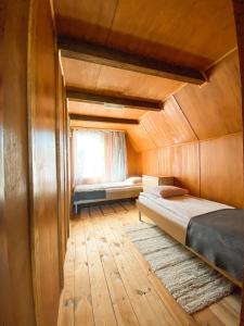 Tempat tidur dalam kamar di Dom Nad Jeziorem Mazury