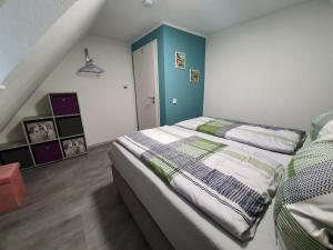 Postel nebo postele na pokoji v ubytování Ferienwohnung „Forsthaus Bigge“