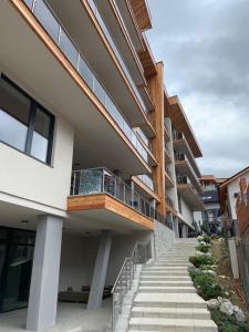 an external view of a building with stairs at Hrebienok 2 Apartman D109 in Smokovce