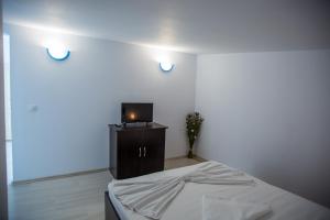 Postel nebo postele na pokoji v ubytování Andreea Residence Mamaia Nord