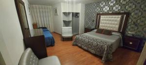 Posteľ alebo postele v izbe v ubytovaní Hostal del campo