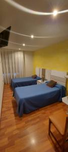 Posteľ alebo postele v izbe v ubytovaní Hostal del campo