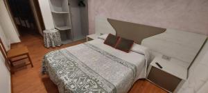 Posteľ alebo postele v izbe v ubytovaní Hostal del campo