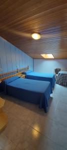 Posteľ alebo postele v izbe v ubytovaní Hostal del campo