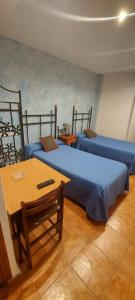 Posteľ alebo postele v izbe v ubytovaní Hostal del campo