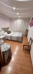 Posteľ alebo postele v izbe v ubytovaní Hostal del campo