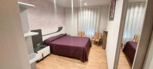 Postel nebo postele na pokoji v ubytování Hostal del campo