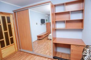 a sliding glass door in a room with a living room at ул. Героев Днепра 5, рядом Днепр in Cherkasy