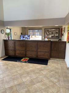 a pharmacyacist counter in a room with a tile floor at Super 8 by Wyndham Baytown I-10 in Baytown