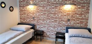 Posteľ alebo postele v izbe v ubytovaní APARTAMENT CENTRUM PARK ul WASZYNGTONA