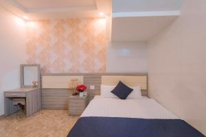 Postel nebo postele na pokoji v ubytování Khanh Uyen 1 Hotel