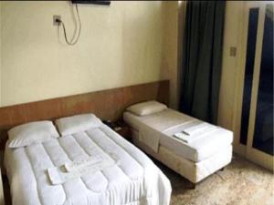 Cama ou camas em um quarto em OYO Hotel Ana Cassia