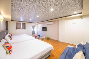 Katil atau katil-katil dalam bilik di Luodong Nightmarket Homestay