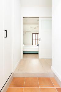 Letto o letti in una camera di サンライズハワイ