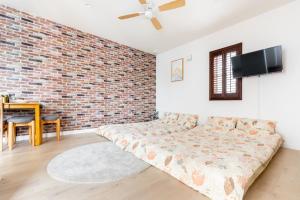 Letto o letti in una camera di サンライズハワイ