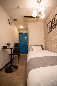 Giường trong phòng chung tại Vail sta Takenotsuka