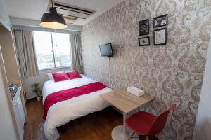 Giường trong phòng chung tại Vail sta Takenotsuka