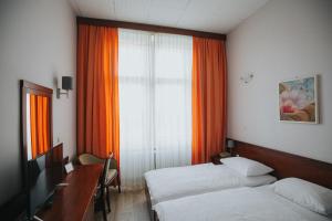 Postel nebo postele na pokoji v ubytování Hotel Central