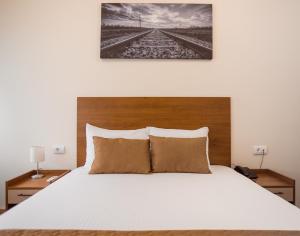 Postel nebo postele na pokoji v ubytování Sajam Garni hotel