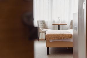 Postel nebo postele na pokoji v ubytování Sajam Garni hotel