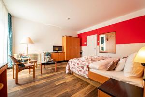 TV a/nebo společenská místnost v ubytování Hotel Villa Halliger