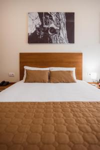 Postel nebo postele na pokoji v ubytování Sajam Garni hotel