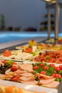 a tray of different types of food on a table at Antoperla Luxury Hotel & Spa in Perissa