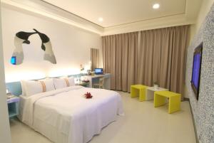 Postel nebo postele na pokoji v ubytování 柜富賓王旅店-台北館 Giant Rich King Plaza Hotel
