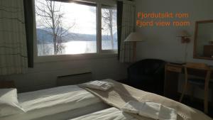 Postel nebo postele na pokoji v ubytování Fjellkysten