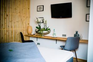 TV a/nebo společenská místnost v ubytování Gasthaus & Hotel Bischoff
