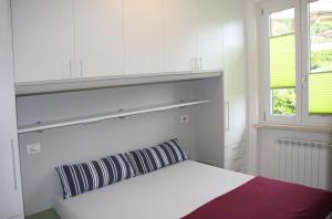 Postel nebo postele na pokoji v ubytování Appartamento Mandorla - Theater Home