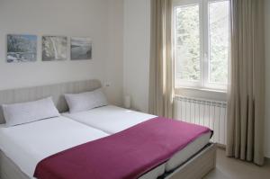 Postel nebo postele na pokoji v ubytování Appartamento Mandorla - Theater Home