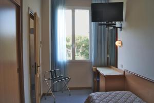 TV a/nebo společenská místnost v ubytování Hotel Sogno