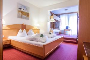 Krevet ili kreveti u jedinici u okviru objekta Hotel Auderer