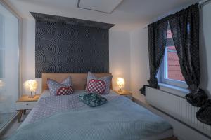 Rúm í herbergi á Boutique-Hotel UPGRADE