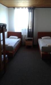 Postel nebo postele na pokoji v ubytování Hotel & Restaurant Adolfovský Dvůr