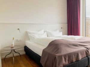Una cama o camas en una habitación de Gasthof Alter Markt
