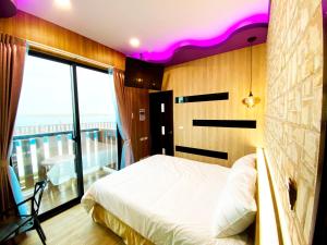 Letto o letti in una camera di 奧斯卡海景民宿Oscar Boutique Seaview Homestay