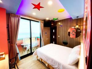 Letto o letti in una camera di 奧斯卡海景民宿Oscar Boutique Seaview Homestay