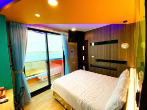Letto o letti in una camera di 奧斯卡海景民宿Oscar Boutique Seaview Homestay