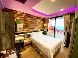 Letto o letti in una camera di 奧斯卡海景民宿Oscar Boutique Seaview Homestay
