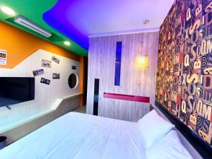 Letto o letti in una camera di 奧斯卡海景民宿Oscar Boutique Seaview Homestay