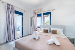 Ένα ή περισσότερα κρεβάτια σε δωμάτιο στο Creta Sky