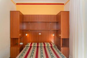 Postel nebo postele na pokoji v ubytování Hotel Dolly