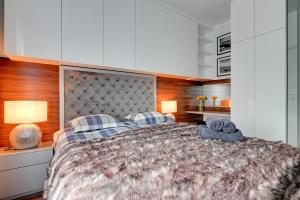 Posteľ alebo postele v izbe v ubytovaní Apartament AGA Motława Starówka