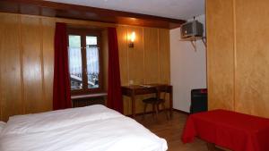 Voodi või voodid majutusasutuse La Vallée Hôtel &Spa toas