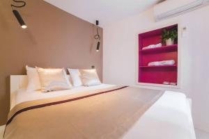 Posteľ alebo postele v izbe v ubytovaní Boutique old town house Karkovich